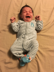 A picture of a crying baby.