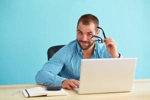 Businessman working in modern office on computer