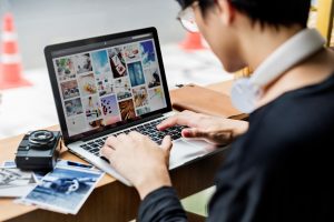 Young man photogrpaher using digital laptop lifestyle