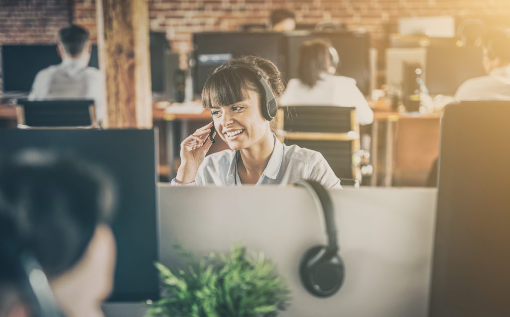 Company employee speaking with customer over the phone.