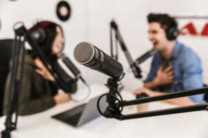Two podcasters hosting a business podcast