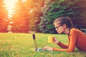 Female sitting outside working on content creation