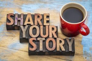 Block words, 'Share Your Story' next to a coffee cup