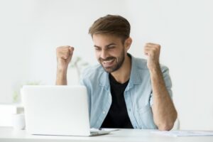 Man excited about website loading quickly and improving SEO.