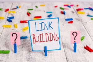 A sign indicating that link building can improve SEO.