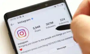  An image of a smartphone displaying an Instagram profile with a well-crafted and engaging bio section. The bio creatively communicates the brand's unique value proposition, personality, and mission in a concise and memorable manner. 